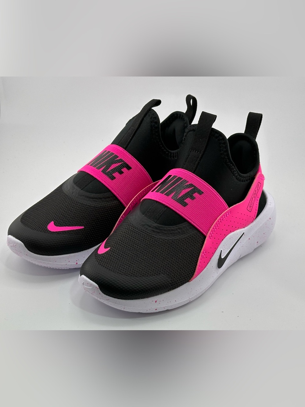 Nike Kids Slip-On Sneakers in Black and Hot Pink Accent